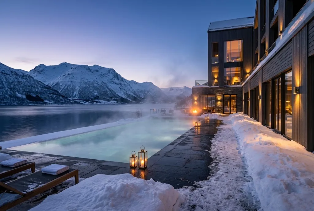 Artist's impression of the planned outdoor infinity pool steaming beside the fjord, with snowy mountains beyond